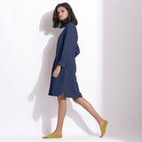 Left View of a Model wearing Navy Blue Cotton Waffle Turtleneck Dress
