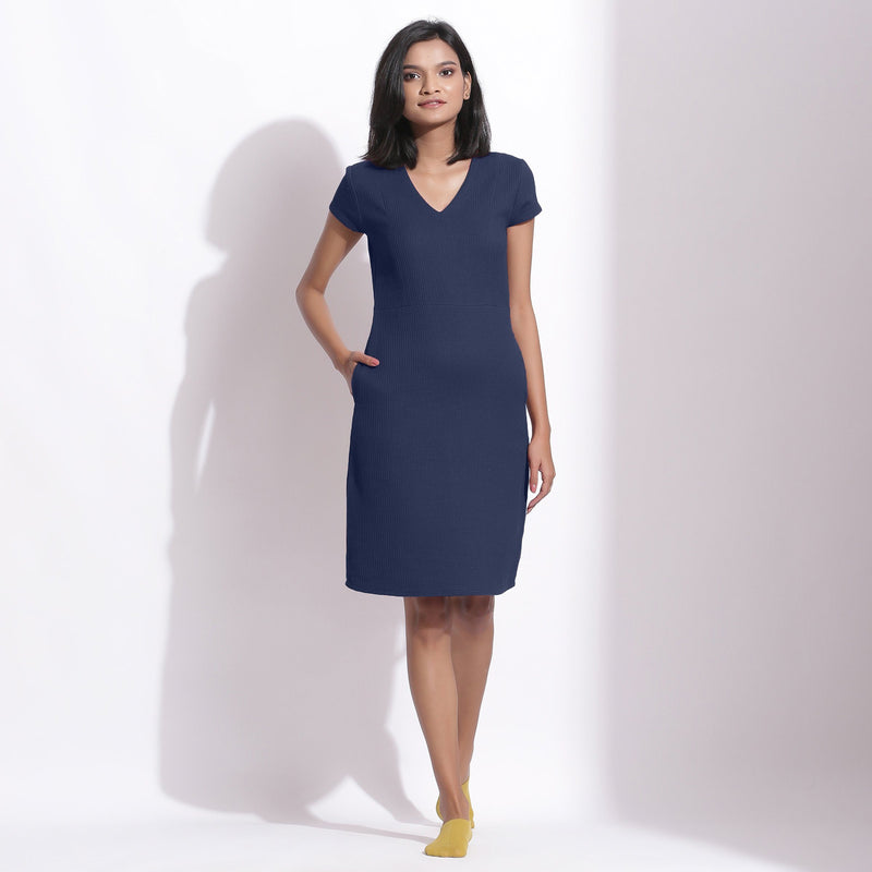 Front View of a Model wearing Navy Blue Cotton Waffle V-Neck Dress