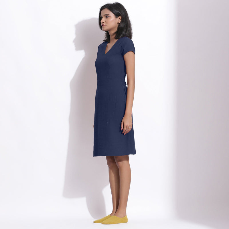 Left View of a Model wearing Navy Blue Cotton Waffle V-Neck Dress