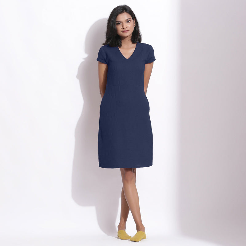 Front View of a Model wearing Navy Blue Cotton Waffle V-Neck Dress