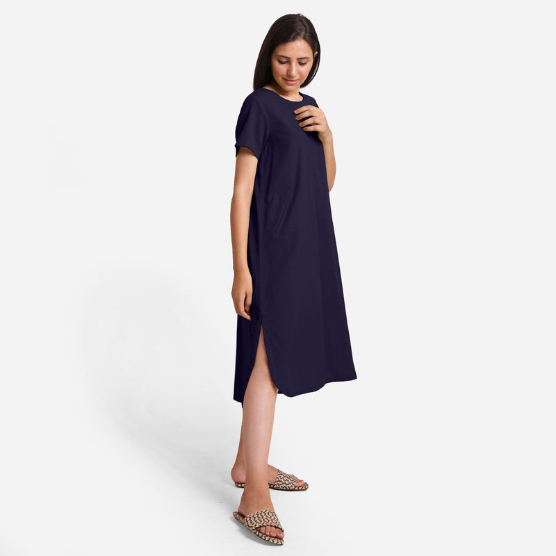 Right View of a Model wearing Navy Blue Cotton Welt Pocket Shift Dress
