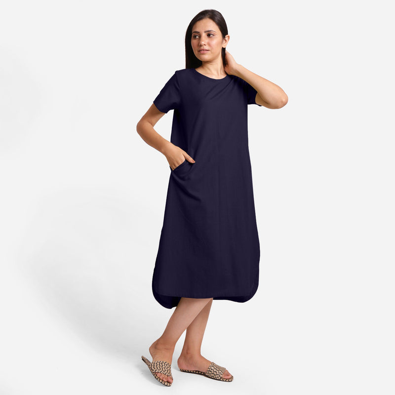 Right View of a Model wearing Navy Blue Cotton Welt Pocket Shift Dress