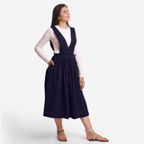 Right View of a Model wearing Navy Blue Deep Neck Pinafore Midi Wrap Dress