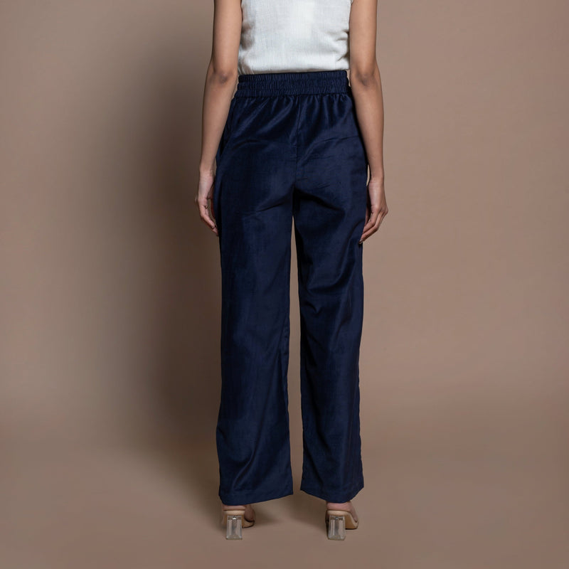 Back View of a Model wearing Navy Blue Cotton Velvet Elasticated High-Rise Pant