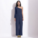 Front View of a Model wearing Navy Blue Honeycomb One-Shoulder Jumpsuit