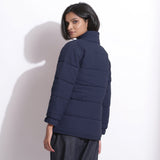 Back View of a Model wearing Navy Blue Waffle Quilted Puffer Jacket