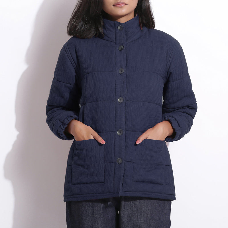 Front Detail of a Model wearing Navy Blue Waffle Quilted Puffer Jacket
