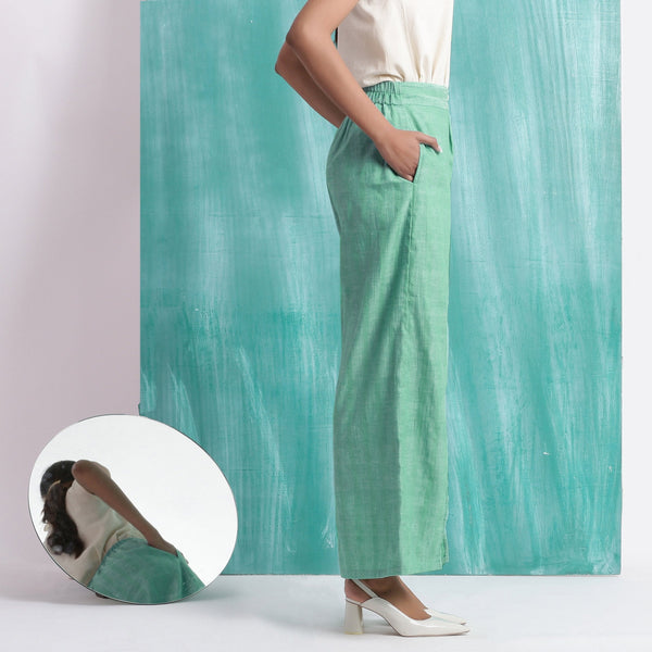 Right View of a Model wearing Ocean Green 100% Cotton Elasticated Mid-Rise Wide Legged Pant