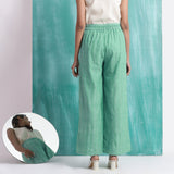 Back View of a Model wearing Ocean Green 100% Cotton Elasticated Mid-Rise Wide Legged Pant