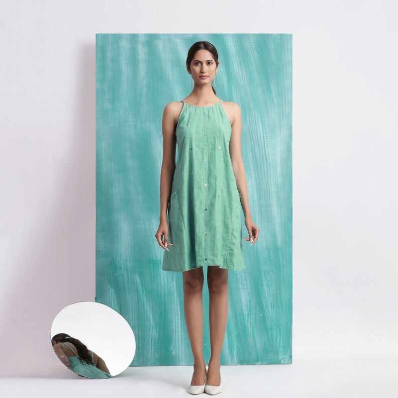 Front View of a Model wearing Ocean Green Handspun Cotton Criss-Cross A-Line Short Dress