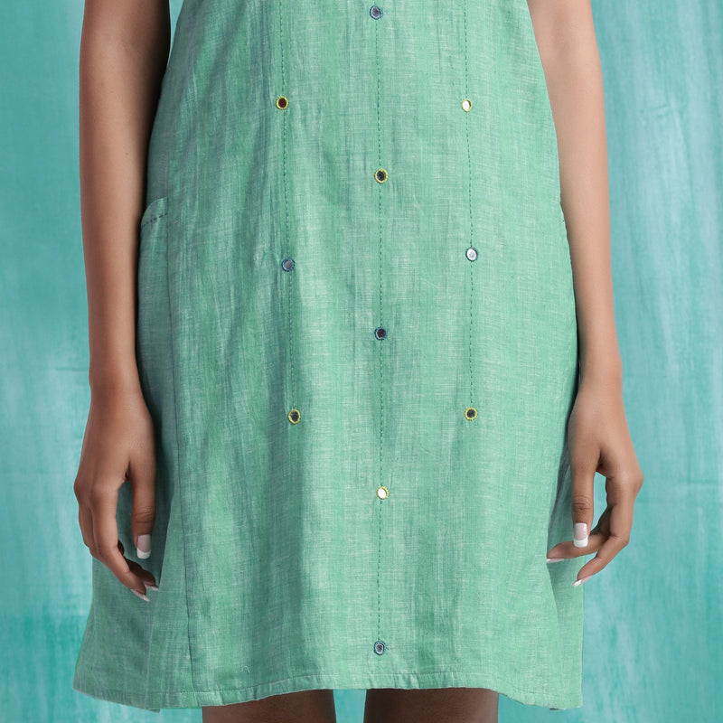 Front Detail of a Model wearing Ocean Green Handspun Cotton Criss-Cross A-Line Short Dress