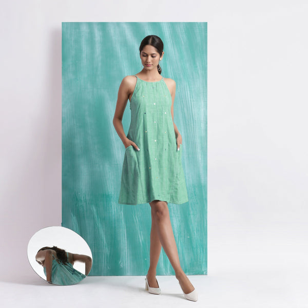 Front View of a Model wearing Ocean Green Handspun Cotton Criss-Cross A-Line Short Dress