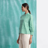 Left View of a Model wearing Ocean Green Handspun 100% Cotton Blouse Top