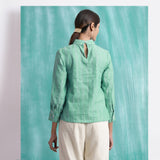 Back View of a Model wearing Ocean Green Handspun 100% Cotton Blouse Top