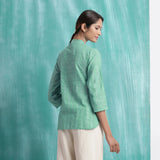 Back View of a Model wearing Ocean Green Handspun Cotton Mandarin Collar Button-Down Top