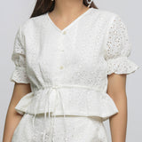 Front Detail of a Model wearing Off-White Cotton Schiffli Floral Top