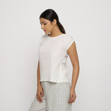 Left View of a Model wearing Off-White 100% Cotton Round Neck Cap Sleeve Top