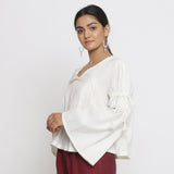 Left View of a Model wearing Off-White Cotton Slub Solid V-Neck Top