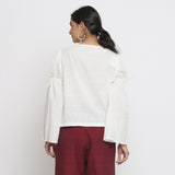 Back View of a Model wearing Off-White Cotton Slub Solid V-Neck Top