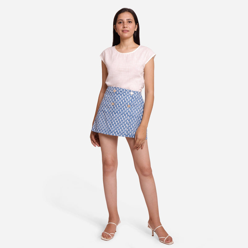 Front View of a Model wearing Off-White Cotton Top and Blue Skirt Set