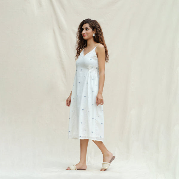 Left View of a Model wearing Off-White Aztec Handspun Cotton Jamdani Midi Slip Dress
