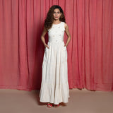 Front View of a Model wearing Off-White Embroidered Cotton Muslin Floor Length Tier Dress