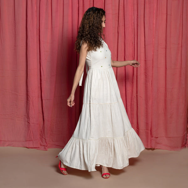 Right View of a Model wearing Off-White Embroidered Cotton Muslin Floor Length Tier Dress