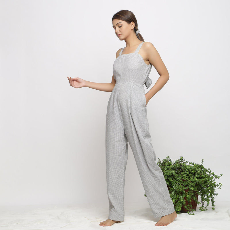 Left View of a Model wearing Off-White Handwoven Cotton Jumpsuit