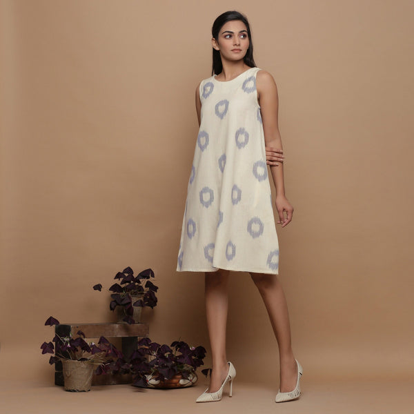 Left View of a Model wearing Off-White Paneled Sleeveless Cotton Dress