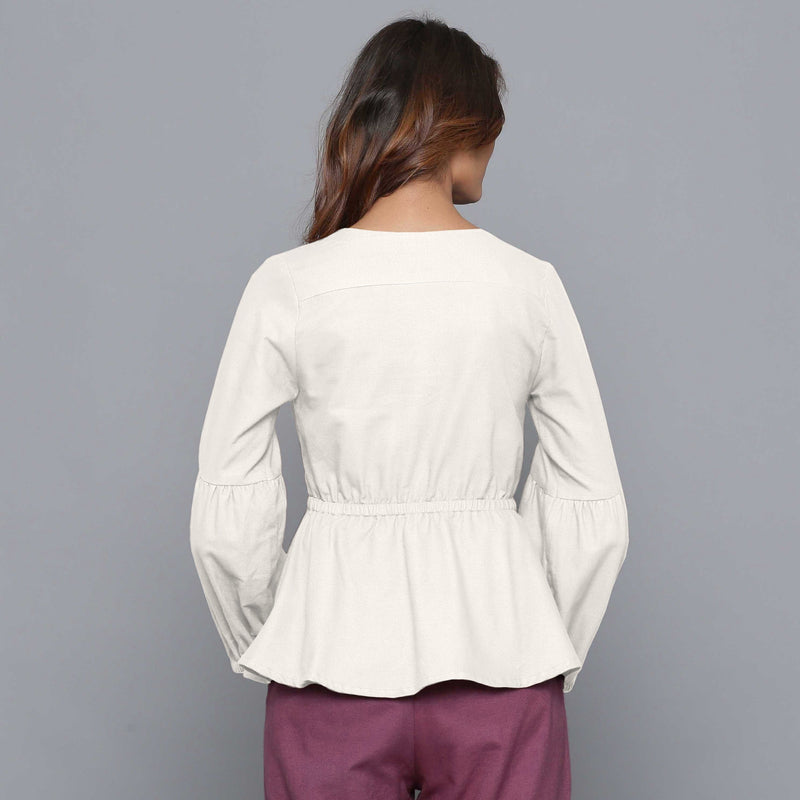 Back View of a Model wearing Off-White V-Neck Flannel Peplum Top