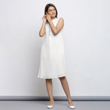 Front View of a Model wearing Off-White Button-Down Shift Dress