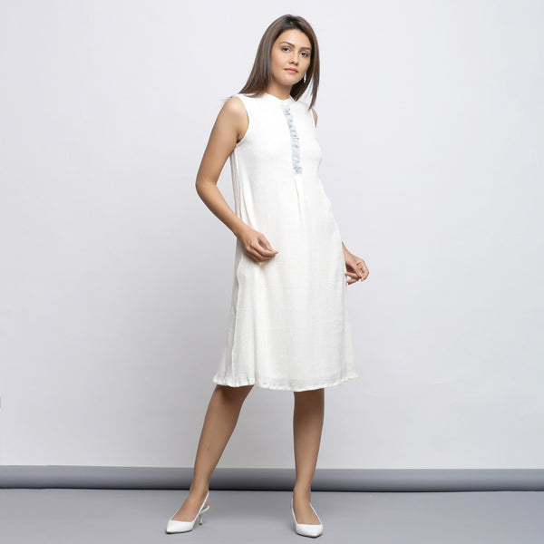 Right View of a Model wearing Off-White Button-Down Shift Dress