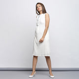 Left View of a Model wearing Off-White Button-Down Shift Dress