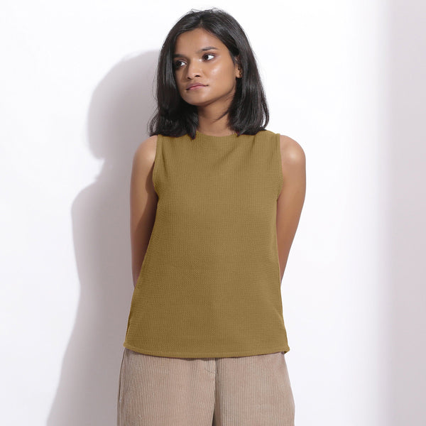Front View of a Model wearing Olive Cotton Waffle Funnel Neck Top