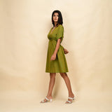 Left View of a Model wearing Olive Gold 100% Cotton Blouson Dress
