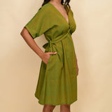 Right Detail of a Model wearing Olive Gold 100% Cotton Blouson Dress