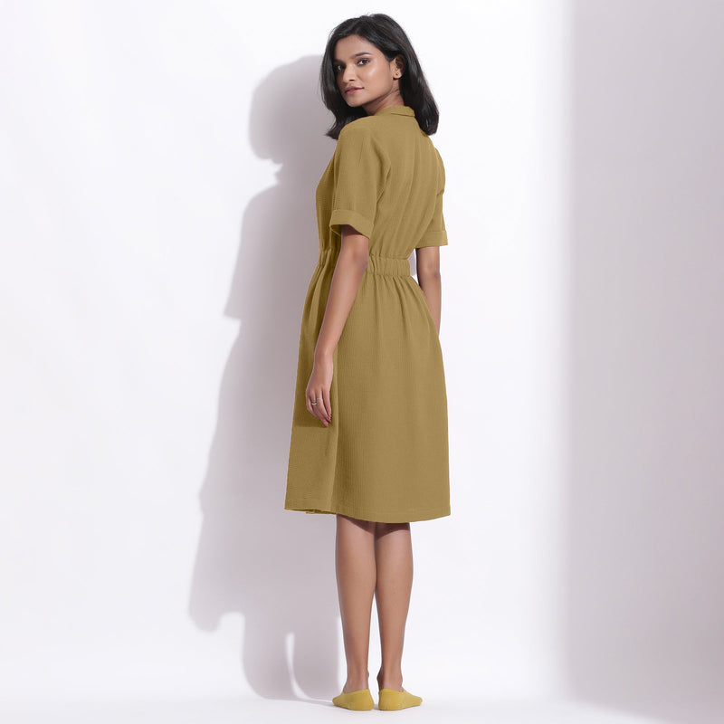 Back View of a Model wearing Olive Green Cotton Waffle Knee Length Coat Dress