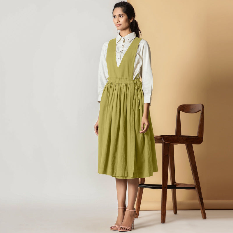 Left View of a Model Wearing Olive Green Cotton Flax Pinafore Midi Wrap Dress