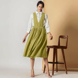 Front View of a Model Wearing Olive Green Cotton Flax Pinafore Midi Wrap Dress