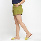 Left View of a Model wearing Olive Green Cotton Flax Short Shorts