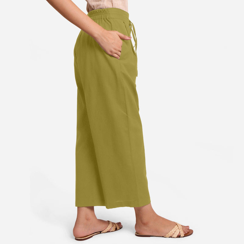 Right View of a Model wearing Olive Green Cotton Flax Wide Legged Pant