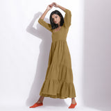 Right View of a Model wearing Olive Green Cotton Honeycomb Waffle Tier Dress