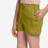 Left View of a Model wearing Olive Green Cotton Straight Shorts