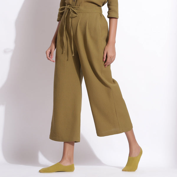 Left View of a Model wearing Olive Green Warm Cotton Waffle Relaxed Culottes