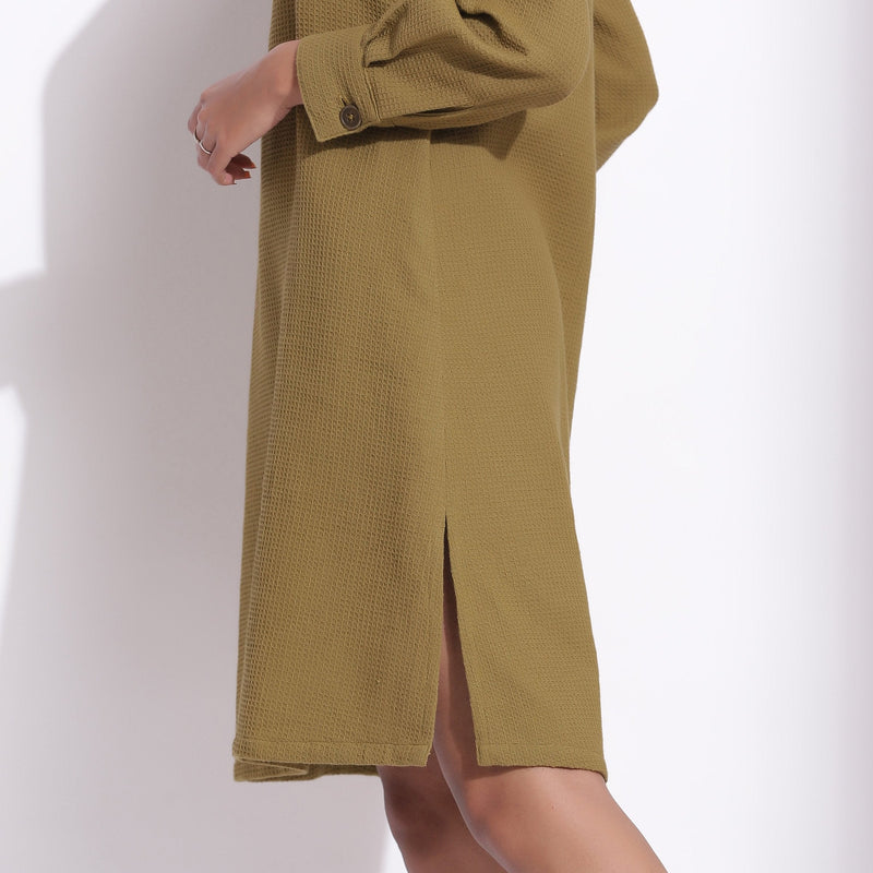 Left Detail of a Model wearing Olive Green Warm Cotton Waffle Knee Length Shift Dress