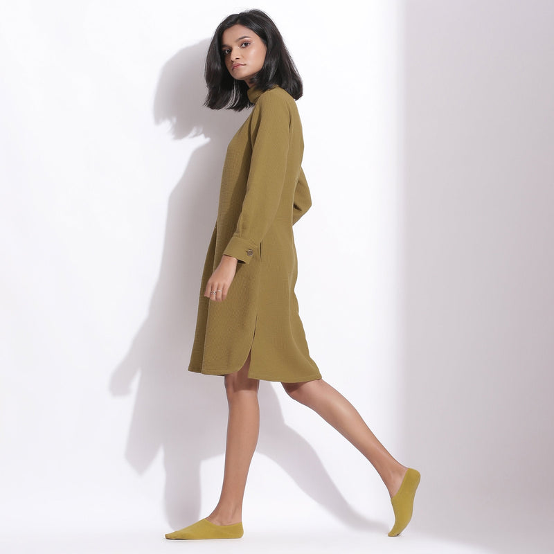 Left View of a Model wearing Olive Green Warm Cotton Waffle Knee Length Shift Dress