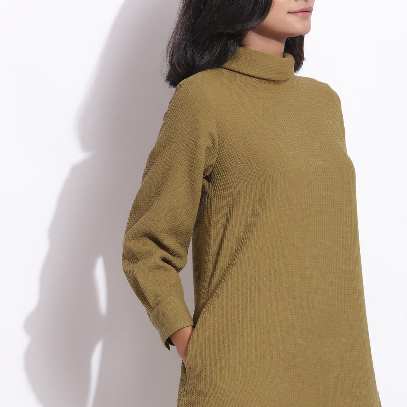 Front Detail of a Model wearing Olive Green Warm Cotton Waffle Knee Length Shift Dress
