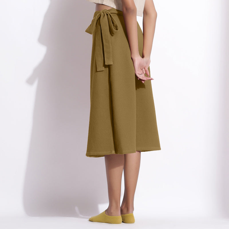 Back View of a Model wearing Olive Green Cotton Waffle Wrap Skirt