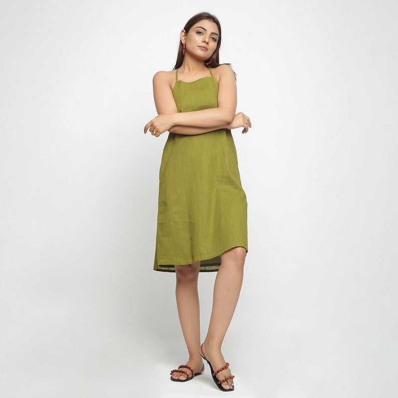Front View of a Model wearing Olive Green Criss-Cross Cotton A-Line Dress
