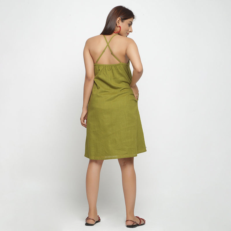 Back View of a Model wearing Olive Green Criss-Cross Cotton A-Line Dress